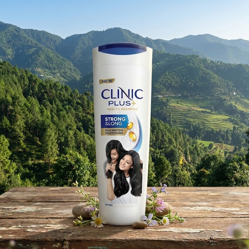 Clinic Plus shampoo bottle with a scenic background of mountains and greenery.