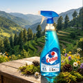 Bottle of Colim cleaning spray on a wooden table with a scenic mountain background