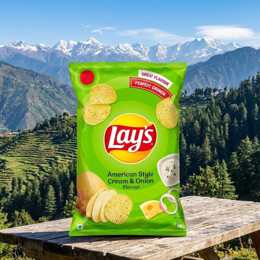 Lay's American Style Cream & Onion flavor packet on a wooden table with a mountainous landscape in the background