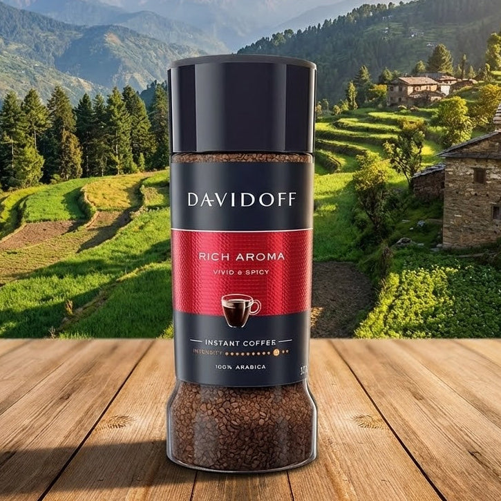 Davidoff Rich Aroma instant coffee jar on a wooden surface with a scenic mountain background