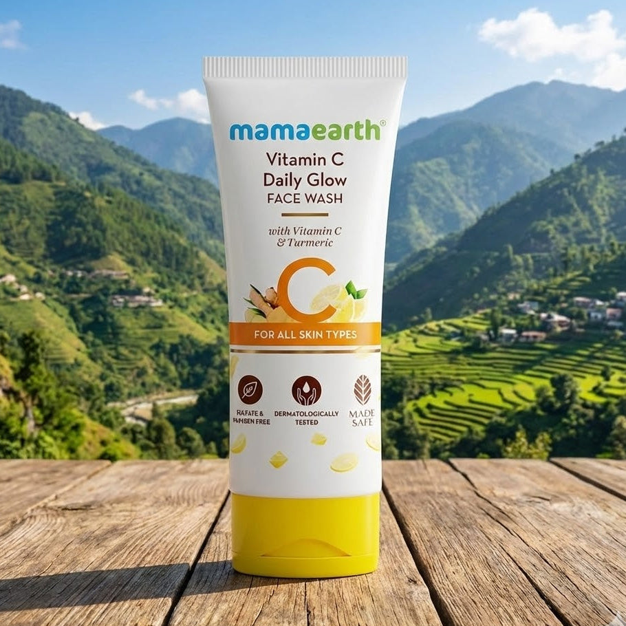 Mamaearth Vitamin C Daily Glow Face Wash tube with a scenic background