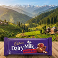 Cadbury Dairy Milk Fruit & Nut chocolate bar with a scenic mountain landscape in the background