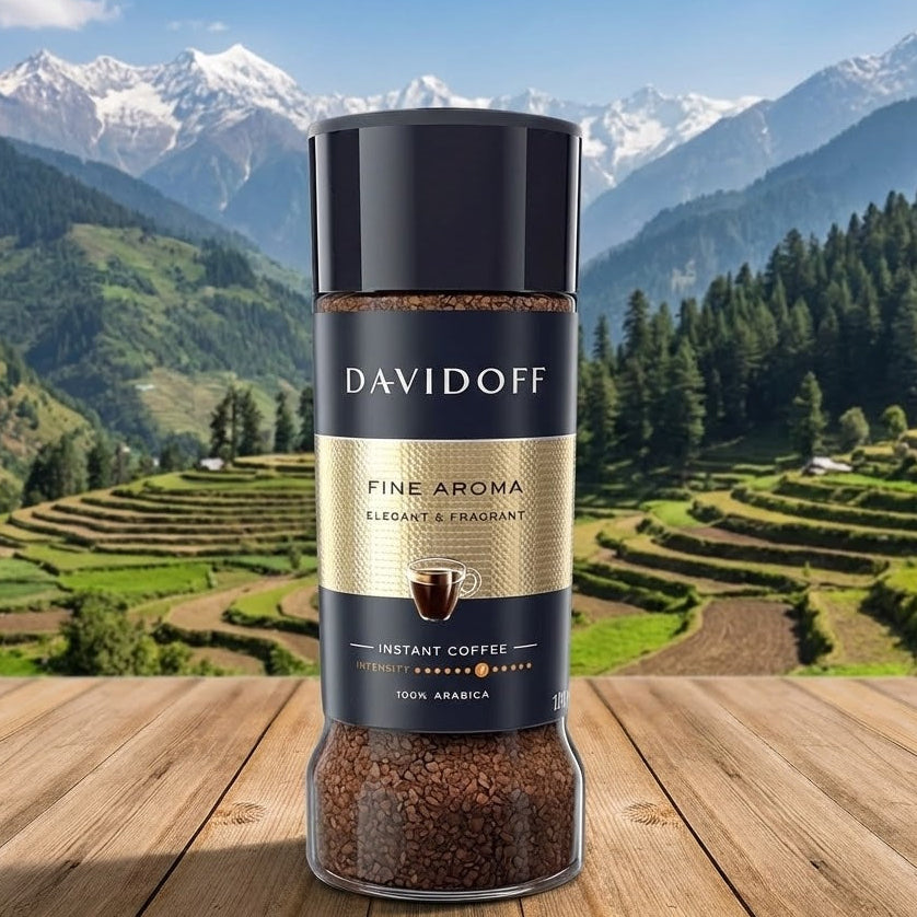 DAVIDOFF coffee jar on a wooden surface with a mountainous landscape in the background