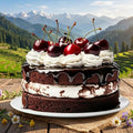 Chocolate cake with whipped cream and cherries on a wooden table with a mountainous landscape in the background