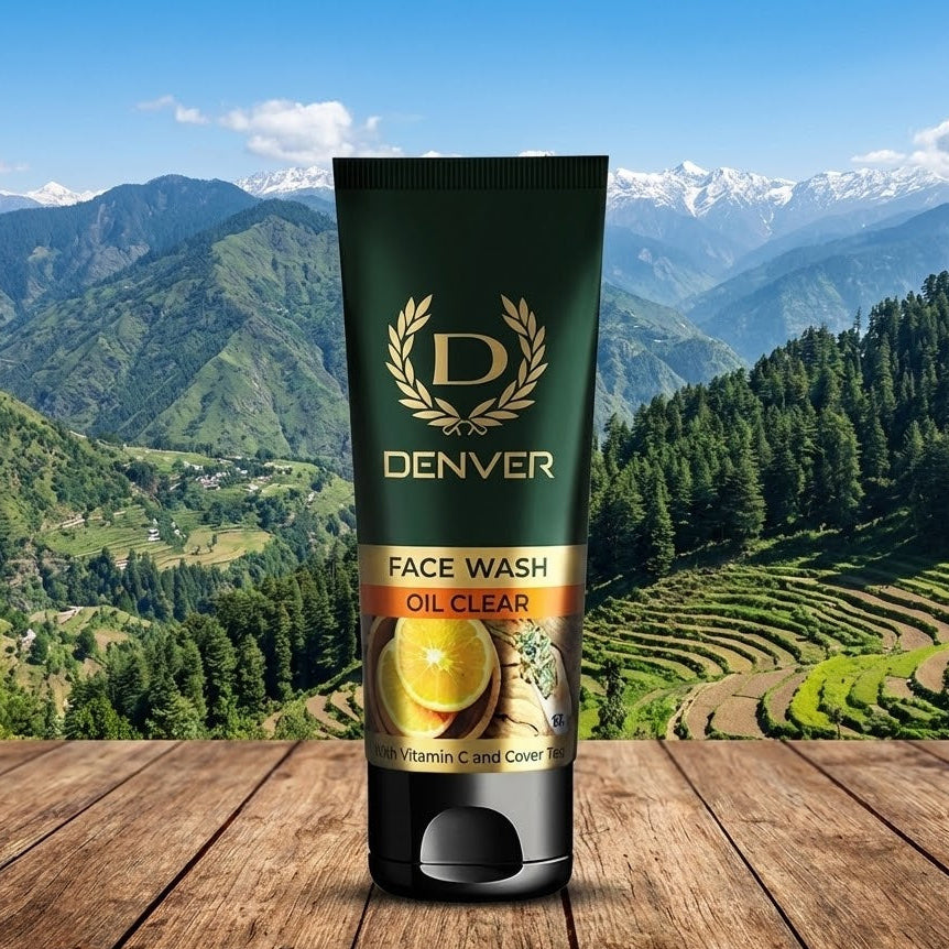 Tube of Denver Face Wash Oil Clear on a wooden surface with a mountainous landscape in the background
