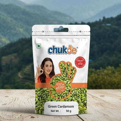 Packaging of Chukde Green Cardamom on a wooden surface with a mountainous landscape in the background
