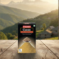 Box of Everest Cumin on a wooden surface with a scenic background