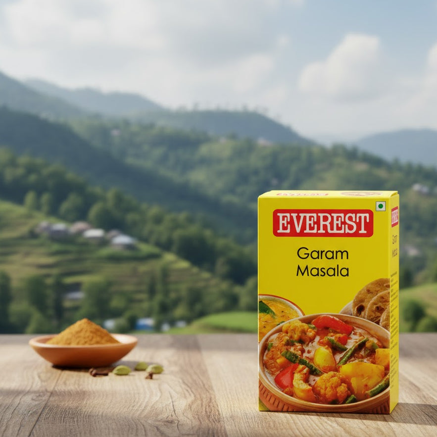 Box of Everest Garam Masala with a scenic background
