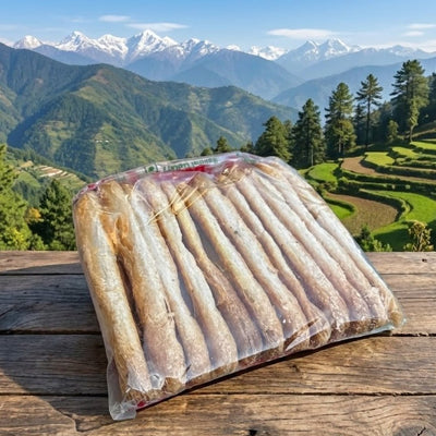 Packaged food on a wooden table with a scenic mountain landscape in the background