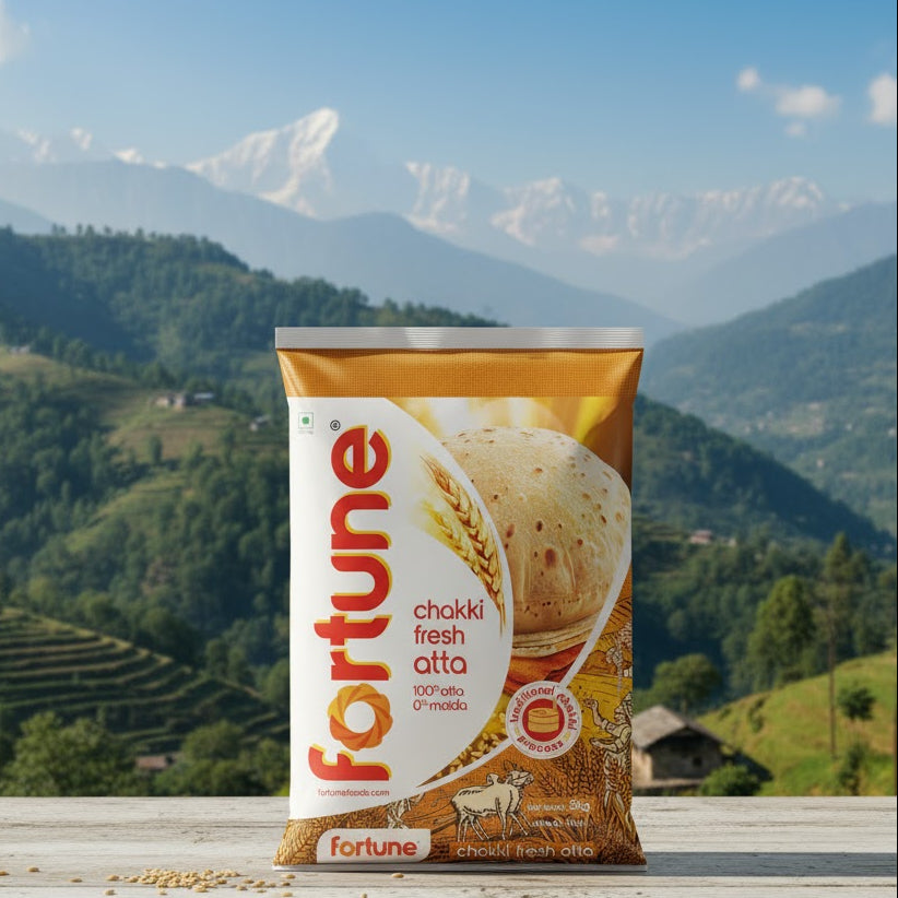 Bag of Fortune chakki fresh atta with a mountainous landscape in the background