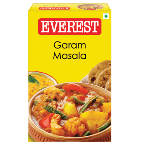 Box of Everest Garam Masala with a bowl of curry and flatbread on a yellow background