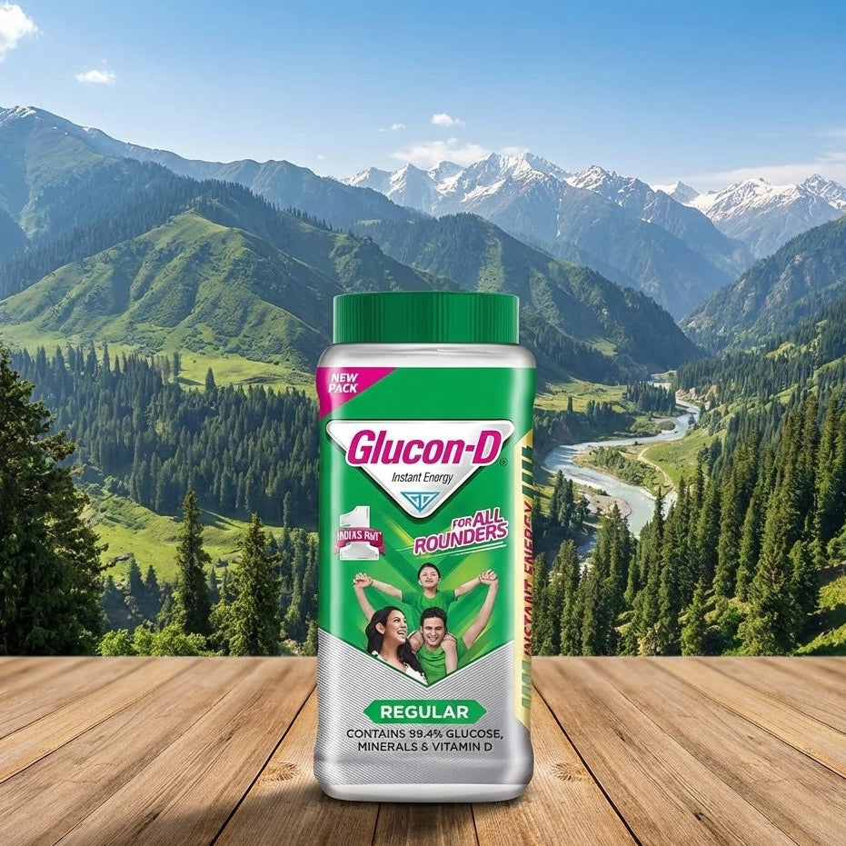 Glucon-D supplement bottle on a wooden surface with a mountainous landscape in the background
