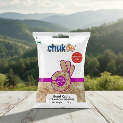 Bag of chukdee Grand Kettle candy on a wooden surface with a scenic background