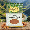 Dhampur Green pure jaggery package with a scenic mountain background