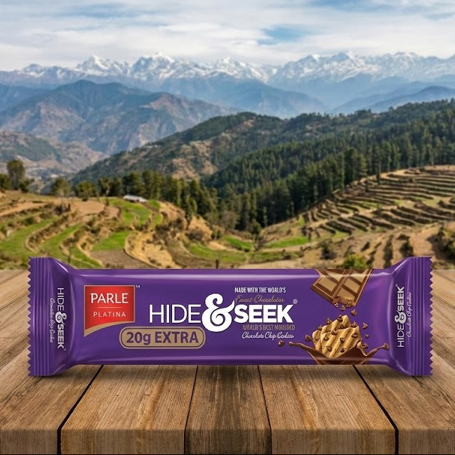 Parle Hide & Seek chocolate bar on a wooden surface with a mountainous landscape in the background