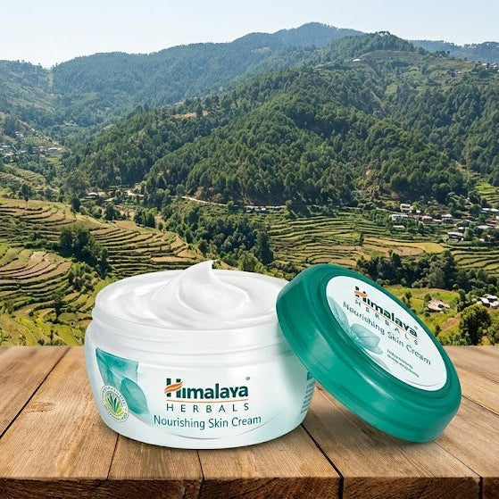 Himalaya Herbals skincare product on a wooden surface with a scenic mountain background