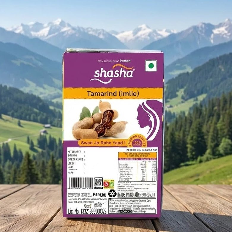 Shasha Tamarind package on a wooden surface with a mountainous landscape in the background