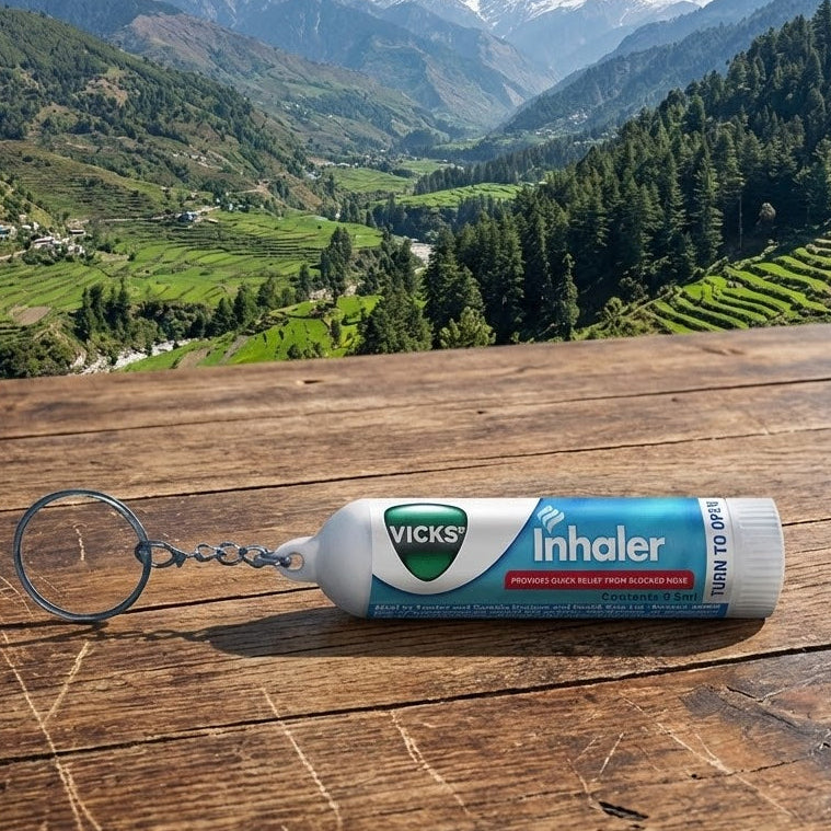 Vicks inhaler on a wooden surface with a mountainous landscape in the background