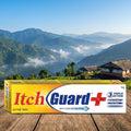 Itch Guard+ box on a wooden surface with a mountainous landscape in the background