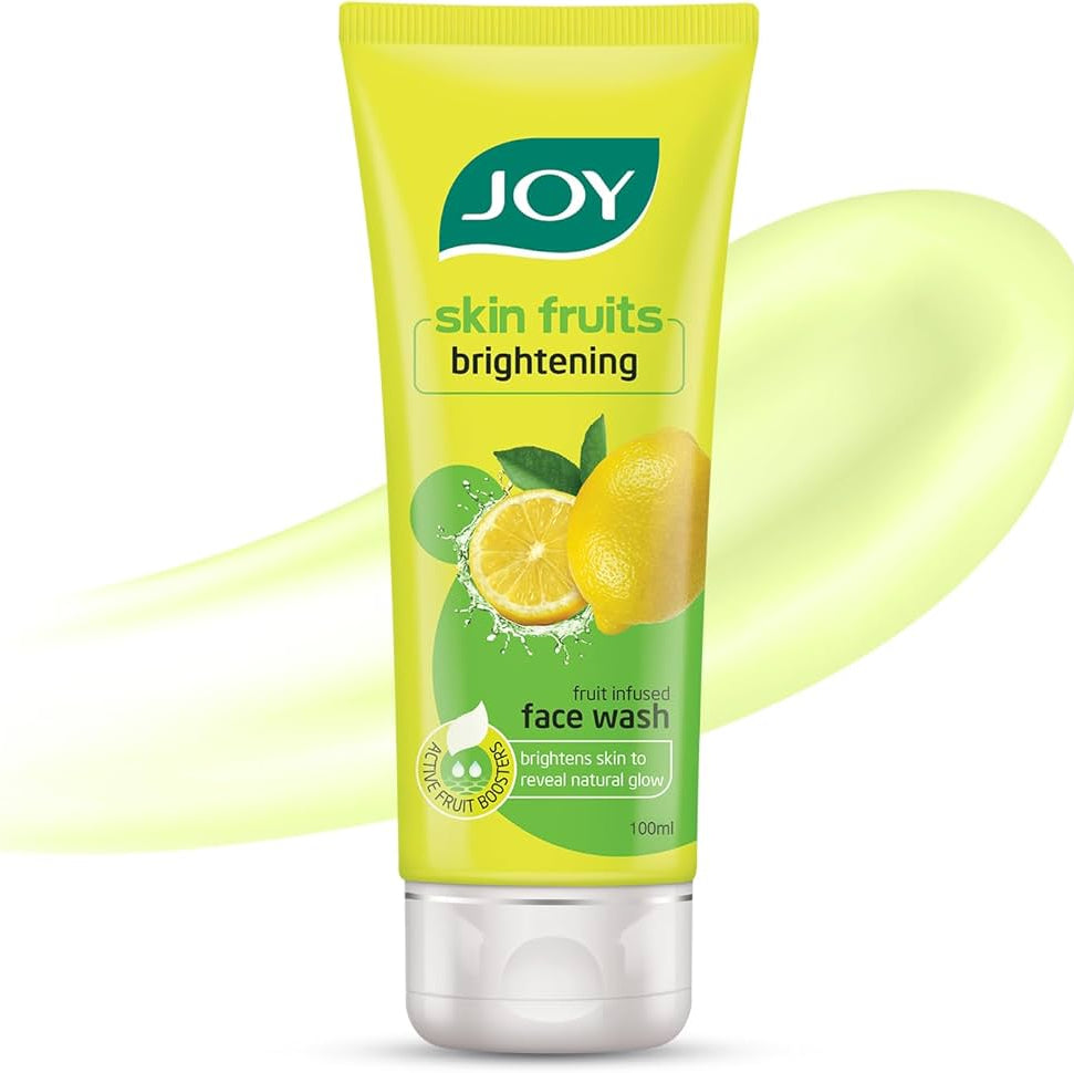 Tube of JOY skin fruits brightening face wash with lemon graphics on a white background