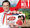 Lifebuoy soap packaging with a doctor holding it, set against a scenic background