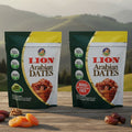 Two packages of Lion Arabian Dates on a wooden surface with a mountainous background