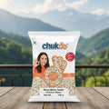 Bag of Chukde Musk Melon Seeds on a wooden surface with a mountainous background