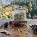 Packaged dried fruits with 'Major Flavours' branding against a scenic mountain backdrop.