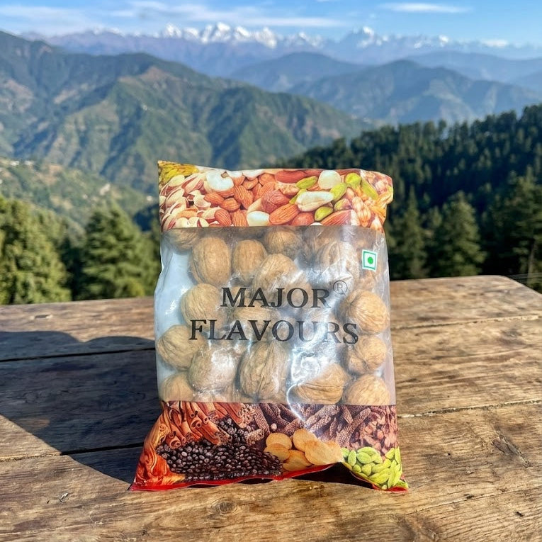 Packaged mix of nuts and seeds with mountainous landscape in the background