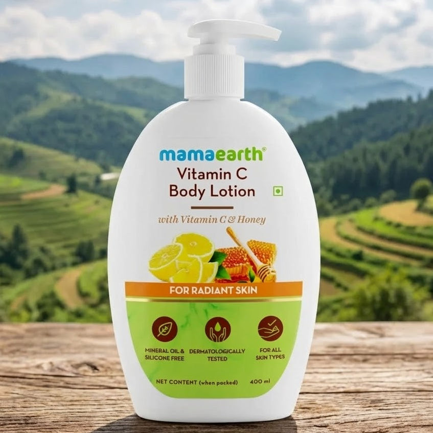 Mamaearth Vitamin C Body Lotion bottle with a scenic background of mountains and greenery.