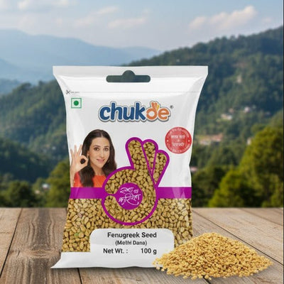 Chukde fenugreek seed package on a wooden surface with a mountainous landscape in the background