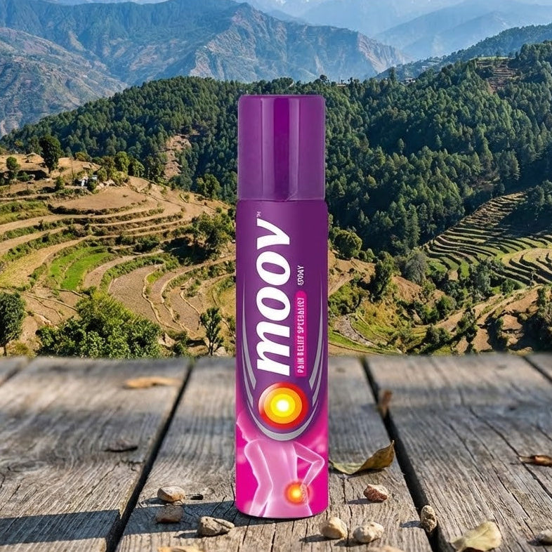 Purple 'moov' product can on a wooden surface with a scenic mountain background