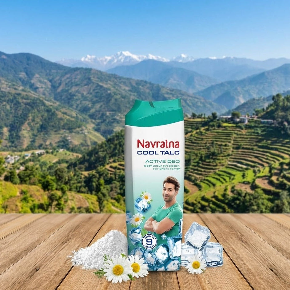 Navrana Cool Talc packaging with talcum powder and crystals on a wooden surface with a mountainous landscape in the background.