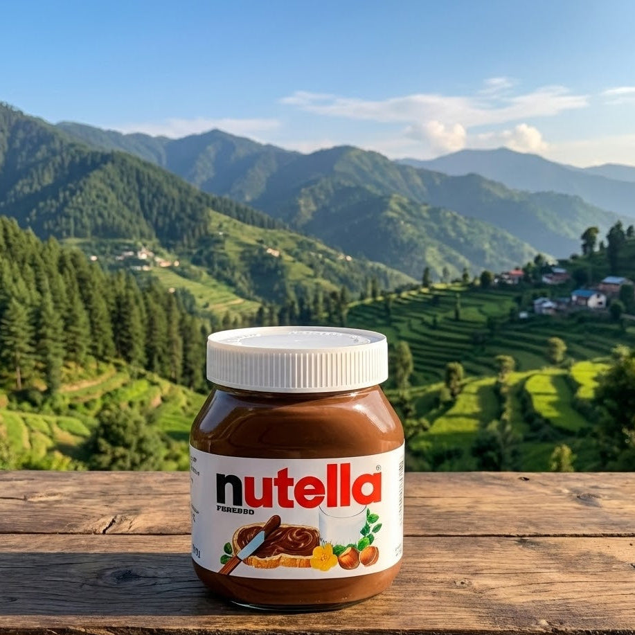 Jar of Nutella on a wooden table with a scenic mountain landscape in the background