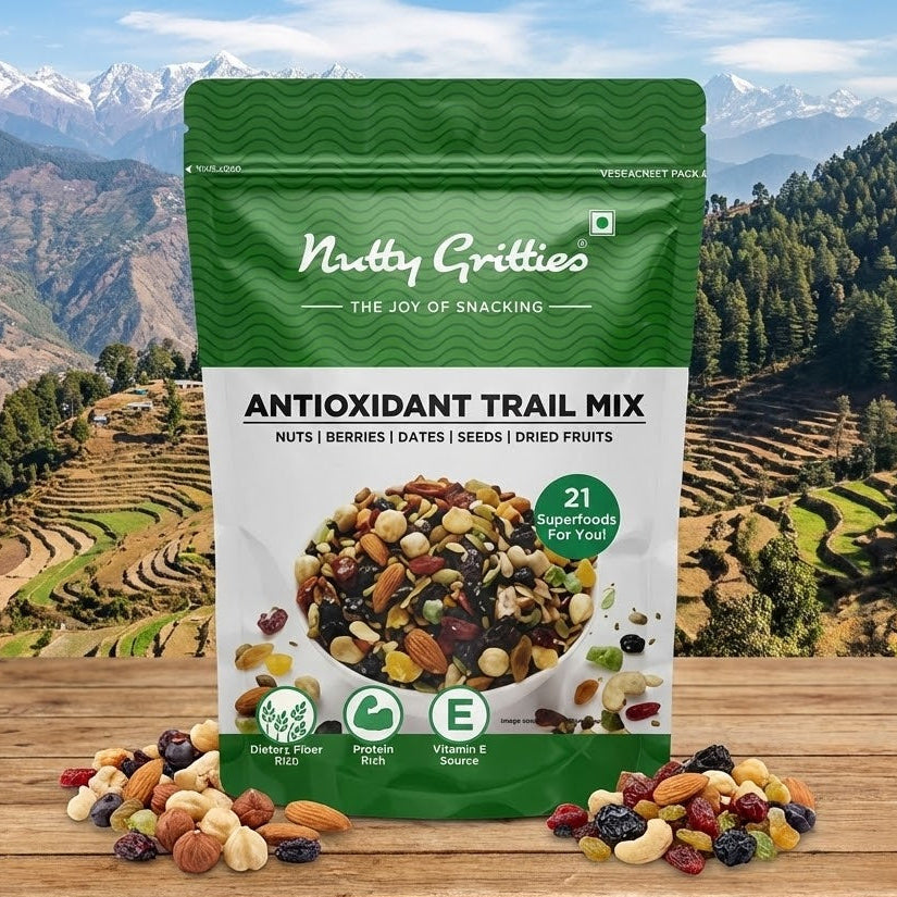 Nutty Gritties antioxidant trail mix package with a scenic background of mountains and terraced fields.