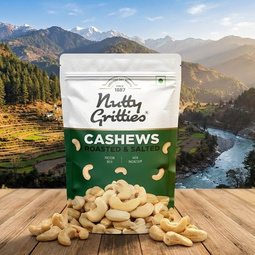 Bag of Nutty Gritties Cashews with a scenic mountain backdrop
