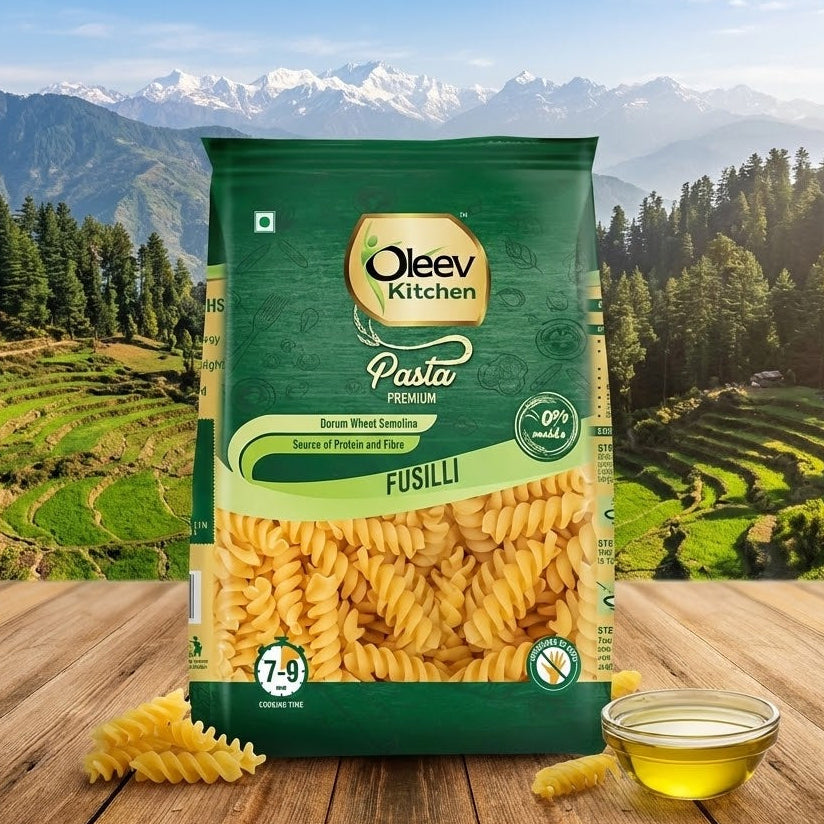 Oleev Kitchen Fusilli pasta package with a scenic background of mountains and trees.