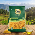Oleev Kitchen Fusilli pasta package with a scenic background of mountains and trees.