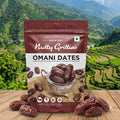 Packaging of Nutty Gritties Omani Dates with a scenic background of mountains and greenery.
