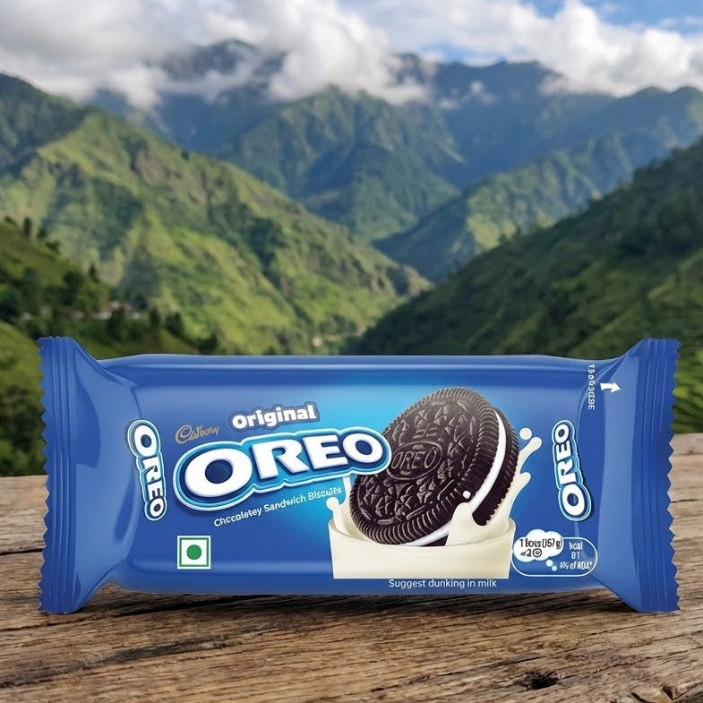 OREO cookie package on a wooden surface with a mountainous landscape in the background