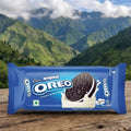 OREO cookie package on a wooden surface with a mountainous landscape in the background