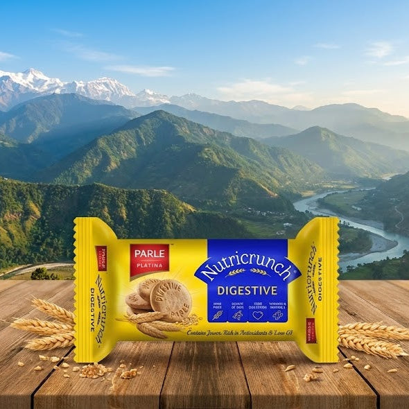 Nutricrunch digestive biscuit package on a wooden surface with a mountainous landscape in the background