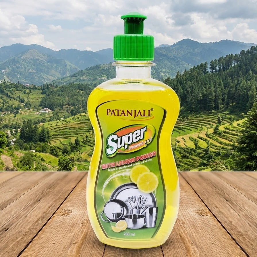 Patanjali Super dishwashing liquid bottle with a green mountainous landscape in the background