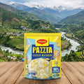 Pazzita Cheese Macaroni package on a wooden surface with a scenic mountain backdrop