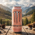 Monster Energy Ultra Peachy Keen can on a wooden surface with a mountainous landscape in the background