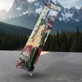 Toy gun in packaging with mountainous landscape in the background