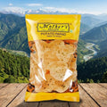 Packaged potato papad with 'Mother's Recipe' branding against a mountainous landscape.
