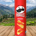 Pringles Original can with a scenic mountain background