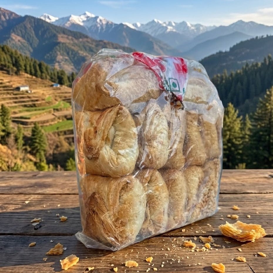 Packaged bread on a wooden surface with a mountainous landscape in the background