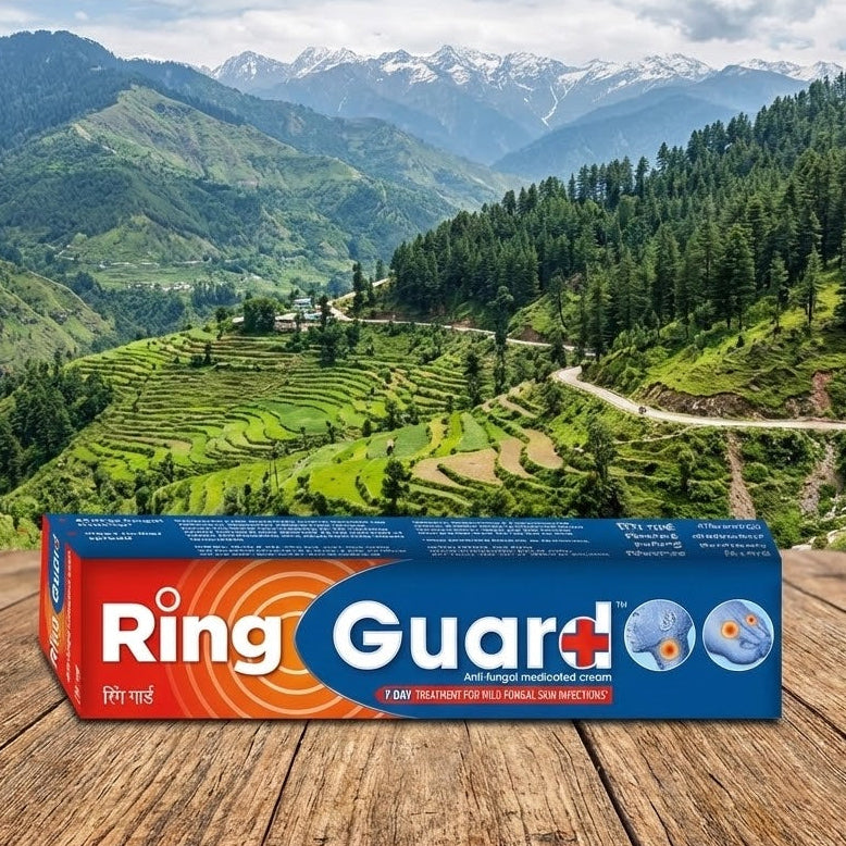 Box of Ring Guard+ on a wooden surface with a scenic mountain landscape in the background